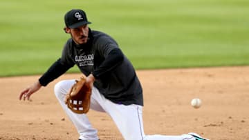DENVER, COLORADO - JULY 09: Nolan Arenado of the Colorado Rockies takes part in fielding drills during summer workouts at Coors Field on July 09, 2020 in Denver, Colorado. (Photo by Matthew Stockman/Getty Images)