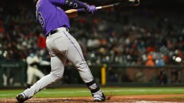 SAN FRANCISCO, CALIFORNIA - APRIL 27: Dom Nunez #3 of the Colorado Rockies drives in a run during the sixth inning of the game against the San Francisco Giants at Oracle Park on April 27, 2021 in San Francisco, California. (Photo by Daniel Shirey/Getty Images)