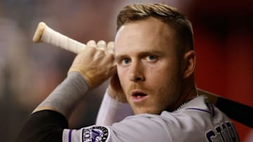 PHOENIX, ARIZONA - MAY 01: Trevor Story #27 of the Colorado Rockies warms up in the dugout during the MLB game against the Arizona Diamondbacks at Chase Field on May 01, 2021 in Phoenix, Arizona. The Rockies defeated the Diamondbacks 14-6. (Photo by Christian Petersen/Getty Images)