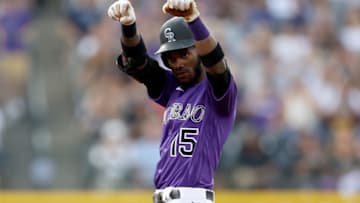 DENVER, COLORADO - JUNE 19: Raimel Tapia #15 of the Colorado Rockies reacts on second base after hitting a double against the Milwaukee Brewers in the first inning at Coors Field on June 19, 2021 in Denver, Colorado. (Photo by Matthew Stockman/Getty Images)