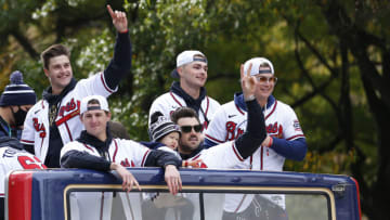 ATLANTA, GEORGIA - NOVEMBER 05: Atlanta Braves players and family members (L-R) Tucker Davidson #64, Kyle Wright #30, Adam Duvall #14 and son Stone, Sean Newcomb #15, Joc Pederson #22 and daughter Poppy celebrate during the World Series Parade on November 05, 2021 in Atlanta, Georgia. (Photo by Michael Zarrilli/Getty Images)