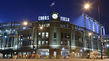 DENVER - JUNE 30: Fans leave the front entrance of Coors Field as the Arizona Diamondbacks play the Colorado Rockies into the evening in the National League game at Coors Field on June 30, 2003 in Denver, Colorado. The Diamondbacks defeated the Rockies 8-7 in 12 innings. (Photo by Brian Bahr/Getty Images)