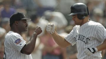 6 May 1997: Left fielder Dante Bichette of the Colorado Rockies high fives manager Don Baylor during a game against the New York Mets at Coors Field in Denver, Colorado. The Rockies won the game 12-11. Mandatory Credit: Brian Bahr /Allsport