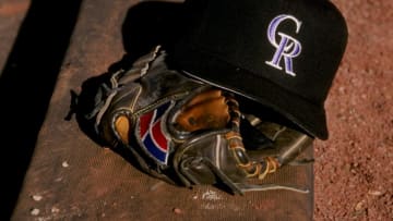27 Feb 1998: A general view of a glove and a Colorado Rockies cap during a spring training game between the Colorado Rockies and the San Francisco Giants at the Hi Corbett Field in Tucson, Arizona. Mandatory Credit: Brian Bahr /Allsport