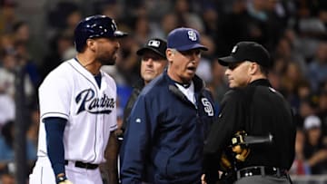 SAN DIEGO, CA - JUNE 1: Matt Kemp #27 of the San Diego Padres, left, and Bud Black #20, center, argue as they are both ejected from the the game by umpire Dan Iossogna, right, during the eighth inning of a baseball game against the New York Mets at Petco Park June 1, 2015 in San Diego, California. (Photo by Denis Poroy/Getty Images)