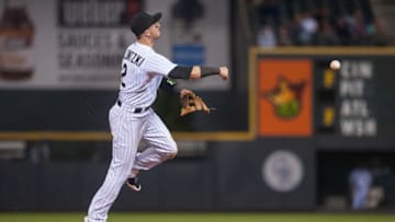DENVER, CO - JUNE 24: Troy Tulowitzki #2 of the Colorado Rockies makes a play at shortstop against the Arizona Diamondbacks during a game at Coors Field on June 24, 2015 in Denver, Colorado. (Photo by Dustin Bradford/Getty Images)