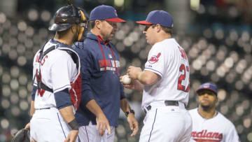 CLEVELAND, OH - MAY 5: Catcher Yan Gomes #10 and pitching coach Mickey Callaway #32 of the Cleveland Indians talk with relief pitcher Bryan Shaw #27 during the eighth inning against the Minnesota Twins at Progressive Field on May 5, 2014 in Cleveland, Ohio. (Photo by Jason Miller/Getty Images)