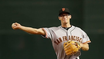 PHOENIX, AZ - SEPTEMBER 07: Infielder Kelby Tomlinson #37 of the San Francisco Giants fields a ground ball during the MLB game against the Arizona Diamondbacks at Chase Field on September 7, 2015 in Phoenix, Arizona. (Photo by Christian Petersen/Getty Images)