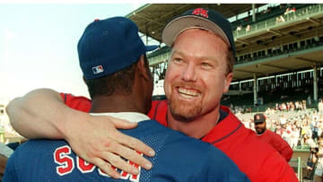 CHICAGO, IL - AUGUST 18: This 18 August 1998 file photo shows St. Louis Cardinals player Mark McGwire (R) hugging Chicago Cubs player Sammy Sosa before their game at Wrigley Field in Chicago, IL. Currently McGwire has 59 homeruns and Sosa 56, giving both players a chance to break the single season record of 61 set in 1961 by New York Yankees player Roger Maris. Despite the competition between them to be the first to break the record, they are close friends. (Photo credit should read FILE/AFP via Getty Images)