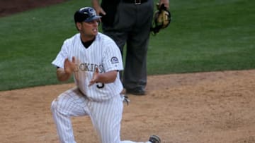 DENVER - APRIL 03: Matt Holliday #5 of the Colorado Rockies celebrates his game-winning run in the bottom of the 11th inning against the Arizona Diamondbacks on opening day at Coors Field April 3, 2006 in Denver, Colorado. Matt Hawpe earned the RBI on a fielders choice to first base. (Photo by Doug Pensinger/Getty Images)