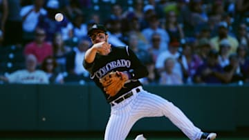 DENVER, CO - SEPTEMBER 5: Nolan Arenado #28 of the Colorado Rockies throws to first in the seventh inning for the second out against the San Francisco Giants at Coors Field on September 5, 2016 in Denver, Colorado. The Colorado Rockies defeat the San Francisco Giants 6-0. (Photo by Bart Young/Getty Images)