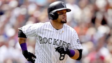 DENVER, CO - APRIL 23: Gerardo Parra #8 of the Colorado Rockies hist a 2 RBI home run in the fourth inning against the San Francisco Giants at Coors Field on April 23, 2017 in Denver, Colorado. (Photo by Matthew Stockman/Getty Images)
