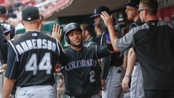 CINCINNATI, OH - MAY 20: Alexi Amarista #2 of the Colorado Rockies celebrates with team members after scoring in the fifth inning against the Cincinnati Reds at Great American Ball Park on May 20, 2017 in Cincinnati, Ohio. (Photo by Michael Hickey/Getty Images)