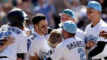 DENVER, CO - JUNE 18: Nolan Arenado #28 of the Colorado Rockies celebrates with his teammates after hitting a 3 RBI walk off home run in the ninth inning against the San Francisco Giants at Coors Field on June 18, 2017 in Denver, Colorado. (Photo by Matthew Stockman/Getty Images)