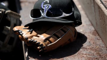 DENVER - APRIL 06: Close-up of the baseball cap, sunglasses and glove of Matt Holliday #5 of the Colorado Rockies on the steps of the Rockies dugout during the MLB game against the Arizona Diamondbacks at Coors Field on April 6, 2008 in Denver, Colorado. (Photo by Steve Dykes/Getty Images)