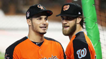 MIAMI, FL - JULY 10: Nolan Arenado #28 of the Colorado Rockies and the National League talks with Bryce Harper #34 of the Washington Nationals and the National League during Gatorade All-Star Workout Day ahead of the 88th MLB All-Star Game at Marlins Park on July 10, 2017 in Miami, Florida. (Photo by Rob Carr/Getty Images)