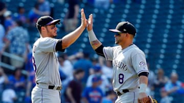 NEW YORK, NY - JULY 16: Nolan Arenado #28 and Gerardo Parra #8 of the Colorado Rockies celebrate after defeating the New York Mets on July 16, 2017 at Citi Field in the Flushing neighborhood of the Queens borough of New York City. (Photo by Jim McIsaac/Getty Images)