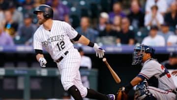 DENVER, CO - AUGUST 16: Mark Reynolds #12 of the Colorado Rockies watches his RBI single during the first inning against the Atlanta Braves at Coors Field on August 16, 2017 in Denver, Colorado. (Photo by Justin Edmonds/Getty Images)