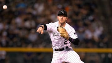 DENVER, CO - SEPTEMBER 02: Trevor Story #27 of the Colorado Rockies throws to first base after fielding a ground ball by A.J. Pollock #11 of the Arizona Diamondbacks in the eighth inning at Coors Field on September 2, 2017 in Denver, Colorado. Arizona won 6-2. (Photo by Joe Mahoney/Getty Images)