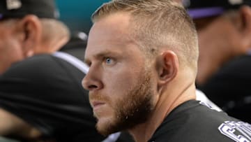 PHOENIX, AZ - SEPTEMBER 14: Trevor Story #27 of the Colorado Rockies watches the game against the Arizona Diamondbacks from the dugout at Chase Field on September 14, 2017 in Phoenix, Arizona. (Photo by Jennifer Stewart/Getty Images)
