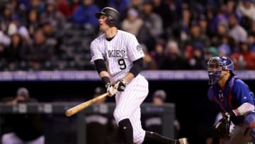 DENVER, CO - APRIL 21: D.J. LeMahieu #9 of the Colorado Rockies hits a RBI double in the fifth inning against the Chicago Cubs at Coors Field on April 21, 2018 in Denver, Colorado. (Photo by Matthew Stockman/Getty Images)