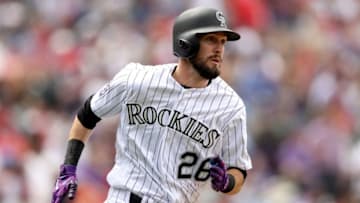 DENVER, CO - MAY 09: David Dahl #26 of the Colorado Rockies hits a double in the third inning against the Los Angeles Angels of Anaheim at Coors Field on May 9, 2018 in Denver, Colorado. (Photo by Matthew Stockman/Getty Images)
