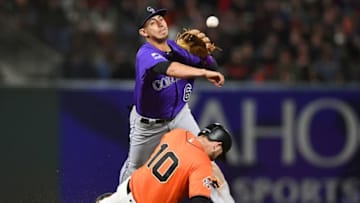 SAN FRANCISCO, CA - MAY 18: Daniel Castro #6 of the Colorado Rockies at second base throws over the top of Evan Longoria #10 of the San Francisco Giants but not in time to get the runner at first base for the double-play at AT&T Park on May 18, 2018 in San Francisco, California. Nick Hundley #5 of the San Francisco Giants was safe at first base on a fielders choice. (Photo by Thearon W. Henderson/Getty Images)