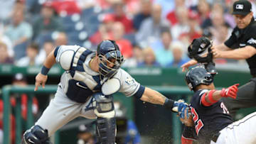 WASHINGTON, DC - JUNE 05: Juan Soto #22 of the Washington Nationals slides by Wilson Ramos #40 of the Tampa Bay Rays to score in the second inning on a Wilmer Difo #2 fielders choice during a baseball game against the Tampa Bay Rays at Nationals Park on June 5, 2018 in Washington, DC. (Photo by Mitchell Layton/Getty Images)