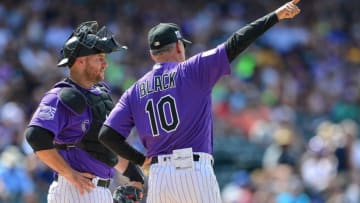 DENVER, CO - JUNE 10: Bud Black #10 of the Colorado Rockies signals defensive changes during a pitching change on the mound with Chris Iannetta #22 in the seventh inning of a game against the Arizona Diamondbacks at Coors Field on June 10, 2018 in Denver, Colorado. (Photo by Dustin Bradford/Getty Images)