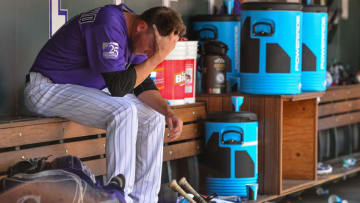 DENVER, CO - JUNE 10: Kyle Freeland #21 of the Colorado Rockies hangs his head in the dugout after allowing three runs to the Arizona Diamondbacks in the sixth inning of a game at Coors Field on June 10, 2018 in Denver, Colorado. (Photo by Dustin Bradford/Getty Images)