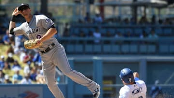 LOS ANGELES, CA - JULY 01: DJ LeMahieu #9 of the Colorado Rockies catches Austin Barnes #15 of the Los Angeles Dodgers in a double play at second base in the seventh inning at Dodger Stadium on July 1, 2018 in Los Angeles, California. (Photo by John McCoy/Getty Images)