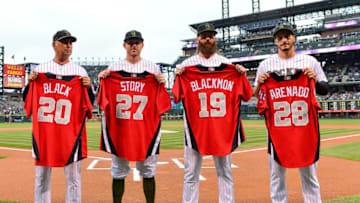 DENVER, CO - JULY 15: All-Star team representatives of the Colorado Rockies (L-R) manager Bud Black #10, Trevor Story #27, Charlie Blackmon #19 and Nolan Arenado #28 stand with their jerseys before a game against the Seattle Mariners at Coors Field on July 15, 2018 in Denver, Colorado. (Photo by Dustin Bradford/Getty Images)