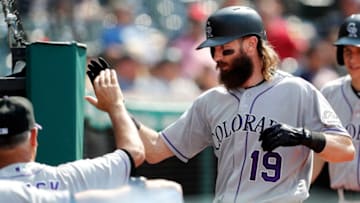 CLEVELAND, OH - AUGUST 09: Charlie Blackmon #19 of the Colorado Rockies is congratulated by Manager Bud Black #10 as he returns to the dugout after hitting the game winning home run against the Cleveland Indians in the 12th inning at Progressive Field on August 9, 2017 in Cleveland, Ohio. The Rockies defeated the Indians 3-2. (Photo by David Maxwell/Getty Images)