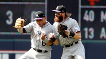 CLEVELAND, OH - AUGUST 09: Charlie Blackmon #19 and Gerardo Parra #8 of the Colorado Rockies celebrate after defeating the Cleveland Indians in 12 innings at Progressive Field on August 9, 2017 in Cleveland, Ohio. (Photo by David Maxwell/Getty Images)