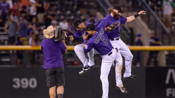 DENVER, CO - AUGUST 18: Colorado Rockies outfielders Carlos Gonzalez