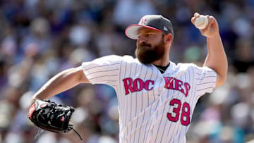 DENVER, CO - MAY 14: Pitcher Mike Dunn #38 of the Colorado Rockies throws in the sixth inning against the Los Angeles Dodgers at Coors Field on May 14, 2017 in Denver, Colorado. Members of both teams were wearing pink in commemoration of Mother's Day weekend. (Photo by Matthew Stockman/Getty Images)
