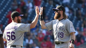 WASHINGTON, DC - JULY 30: Charlie Blackmon #19 of the Colorado Rockies and Greg Holland #56 celebrate a win after game one of a doubleheader baseball game against the Washington Nationals at Nationals Park on July 30, 2017 in Washington, DC. (Photo by Mitchell Layton/Getty Images)