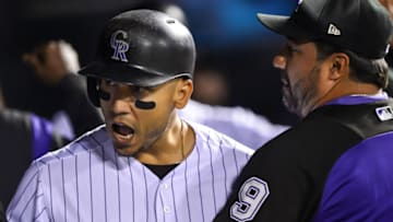DENVER, CO - SEPTEMBER 16: Carlos Gonzalez #5 of the Colorado Rockies celebrates in the dugout after hitting a fifth inning two-run homerun against the San Diego Padres at Coors Field on September 16, 2017 in Denver, Colorado. (Photo by Dustin Bradford/Getty Images)