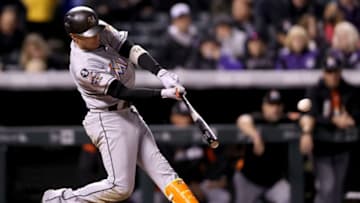 DENVER, CO - SEPTEMBER 25: Miguel Rojas #19 of the Miami Marlins hits a 3 RBI double in the fourth inning against the Colorado Rockies at Coors Field on September 25, 2017 in Denver, Colorado. (Photo by Matthew Stockman/Getty Images)