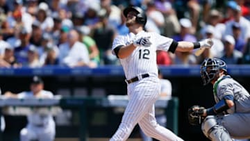DENVER, CO - AUGUST 20: Mark Reynolds #12 of the Colorado Rockies watches his RBI sacrifice fly during the first inning against the Milwaukee Brewers at Coors Field on August 20, 2017 in Denver, Colorado. (Photo by Justin Edmonds/Getty Images)