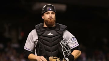 PHOENIX, AZ - SEPTEMBER 12: Catcher Jonathan Lucroy #21 of the Colorado Rockies walks off the field during the MLB game against the Arizona Diamondbacks at Chase Field on September 12, 2017 in Phoenix, Arizona. (Photo by Christian Petersen/Getty Images)