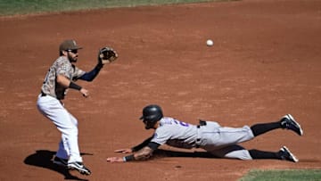 SAN DIEGO, CA - SEPTEMBER 24: Ian Desmond #20 of the Colorado Rockies steals second base ahead of the throw to Carlos Asuaje #20 of the San Diego Padres during the second inning of a baseball game at PETCO Park on September 24, 2017 in San Diego, California. (Photo by Denis Poroy/Getty Images)