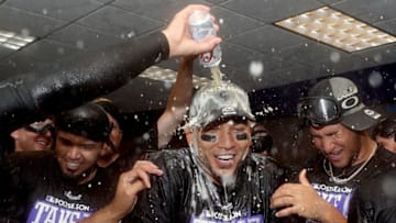 DENVER, CO - SEPTEMBER 30: Carlos Gonzalez #5 of the Colorado Rockies is doused by his teammates in the lockerroom at Coors Field on September 30, 2017 in Denver, Colorado. Although losing 5-3 to the Los Angeles Dodgers, the Rockies celebrated clinching a wild card spot in the post season. (Photo by Matthew Stockman/Getty Images)