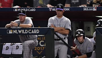 PHOENIX, AZ - OCTOBER 04: Manager Bud Black #10 of the Colorado Rockies (center) and bench coach Mike Redmond #11 watch the action during the first inning of the National League Wild Card game against the Arizona Diamondbacks at Chase Field on October 4, 2017 in Phoenix, Arizona. (Photo by Norm Hall/Getty Images)