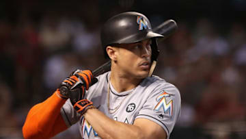 PHOENIX, AZ - SEPTEMBER 24: Giancarlo Stanton #27 of the Miami Marlins warms up on deck during the MLB game against the Arizona Diamondbacks at Chase Field on September 24, 2017 in Phoenix, Arizona. (Photo by Christian Petersen/Getty Images)