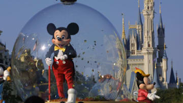 397155 06: Mickey Mouse rides in a parade through Main Street, USA with Cinderella's castle in the background at Disney World's Magic Kingdom November 11, 2001 in Orlando, Florida. (Photo by Joe Raedle/Getty Images)