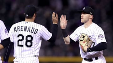 DENVER, CO - SEPTEMBER 26: Nolan Arenado # 28 and Trevor Story #27 of the Colorado Rockies celebrate their win against the Miami Marlins at Coors Field on September 26, 2017 in Denver, Colorado. (Photo by Matthew Stockman/Getty Images)