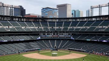 DENVER, CO - APRIL 25: The Denver skyline provides a backdrop for the ballpark as the field is prepared for the Pittsburgh Pirates to face the Colorado Rockies at Coors Field on April 25, 2016 in Denver, Colorado. The Pirates defeated the Rockies 6-1. (Photo by Doug Pensinger/Getty Images)