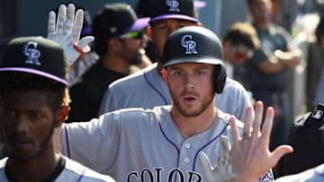 LOS ANGELES, CA - SEPTEMBER 10: Trevor Story #27 of the Colorado Rockies is greeted in the dugout after a solo home run in the ninth inning of the game against the Los Angeles Dodgers at Dodger Stadium on September 10, 2017 in Los Angeles, California. (Photo by Jayne Kamin-Oncea/Getty Images)