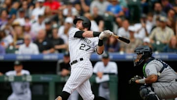 DENVER, CO - SEPTEMBER 17: Trevor Story #27 of the Colorado Rockies connects for a two RBI base hit in the bottom of the fourth inning of a regular season MLB game between the Colorado Rockies and the visiting San Diego Padres at Coors Field on September 17, 2017 in Denver, Colorado. (Photo by Russell Lansford/Getty Images)